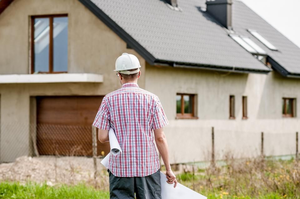 Builder walking a residential construction site